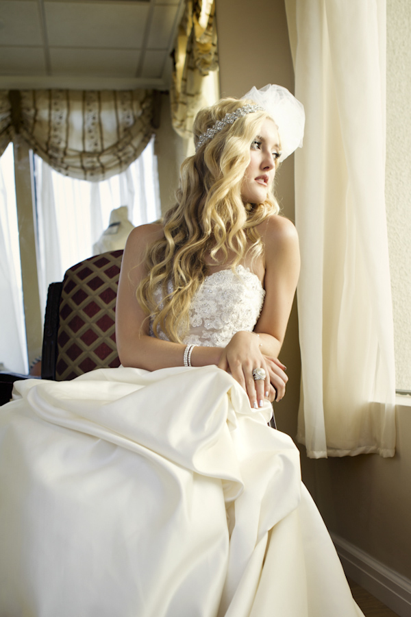 bride looking out window - wedding photo by top Orange County, California wedding photographers D. Park Photography